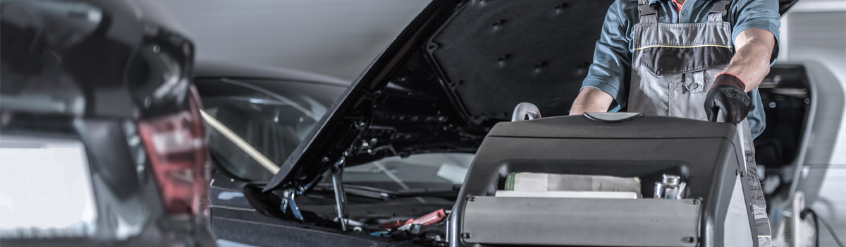 Mechanic doing an air con regas - Car Air Conditioning Catford